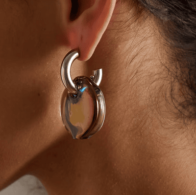 unusual hoop earrings with a gold hoop at the top and a dangling iridescent object