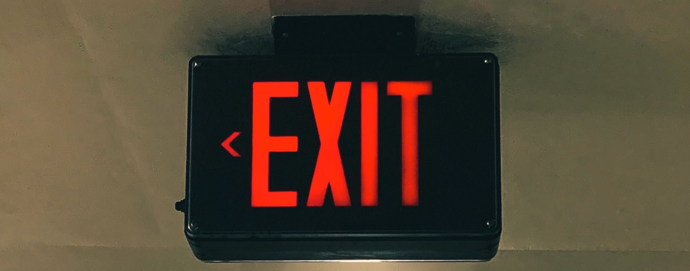 red-lighted EXIT sign