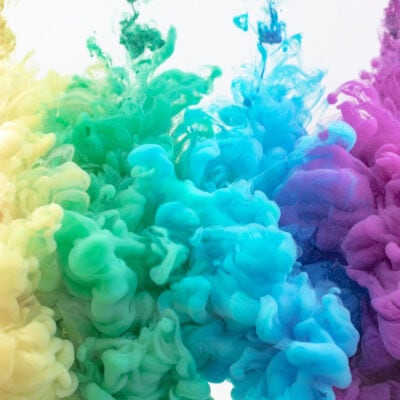 abstract display of red, yellow, green, blue and purple -- possibly puffs of colored smoke but maybe just artsy design