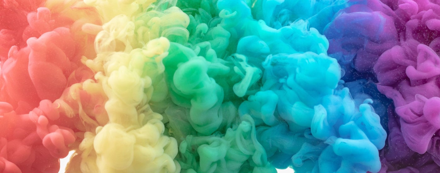 abstract display of red, yellow, green, blue and purple -- possibly puffs of colored smoke but maybe just artsy design