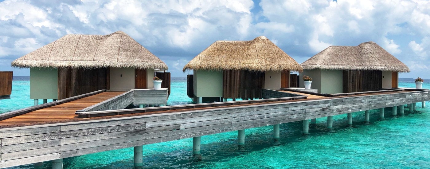 over-water bungalows somewhere tropical