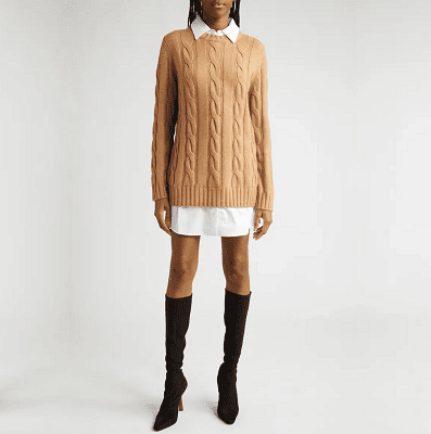 woman wears beige sweater with white shirt dress beneath and black boots; it's a dress but yes it looks like she has no pants