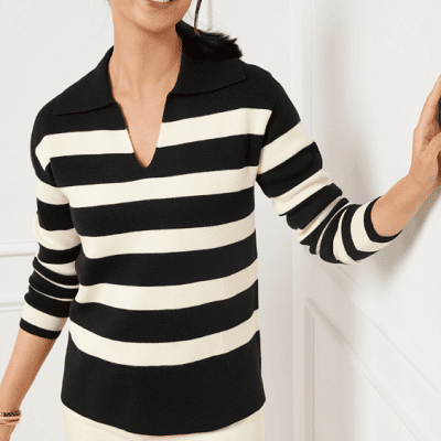 A woman wearing a black and white stripe sweater