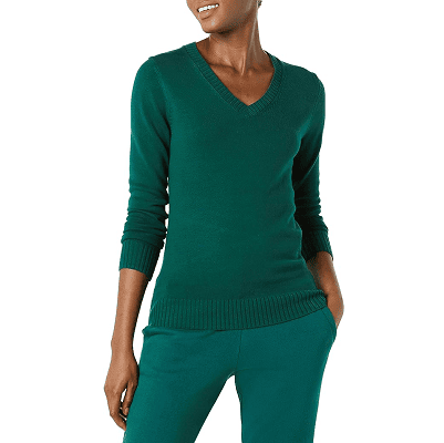woman wears pretty green V-neck plain cotton sweater with green pants; the cotton sweater is thin enough to fit under a suit jacket