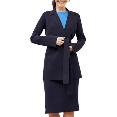 stylish professional young woman wears long sweater jacket that she is belting over a matching navy skirt; it almost looks like a suit