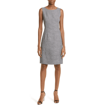 woman wears sheath dress with small gray plaid print on the front