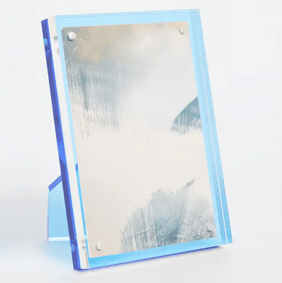 blue lucite picture frame that looks like a darker blue from certain angles