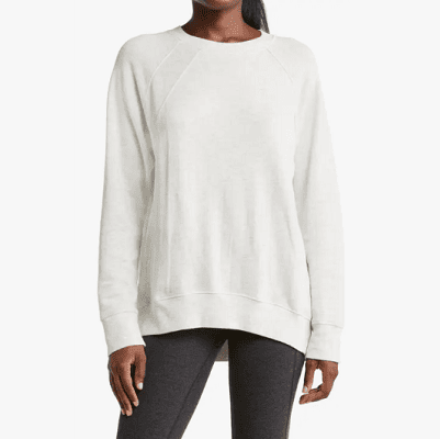 woman wears white sweatshirt that looks really soft