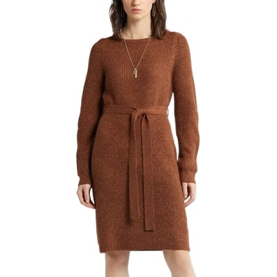 A woman wearing a rust-brown sweater dress