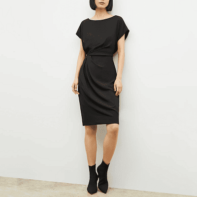 black dress with wide neckline, dolman sleeves, and drapey detail at waist