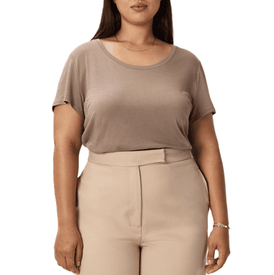 woman wears simple brownish plus-size tee with beige pants