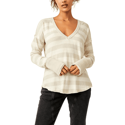 woman wears beige and ivory striped t-shirt with V-neck and long solid cuffs