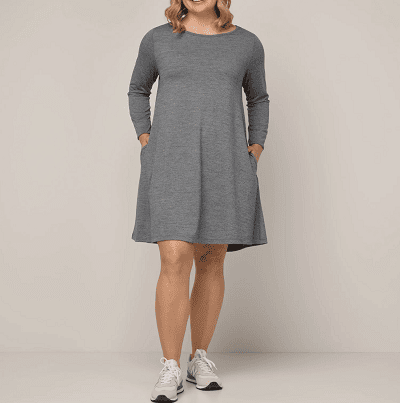 woman wears wool swing dress with pockets