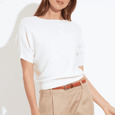 white sweater tee with tucked sleeves and a slightly wider neckline
