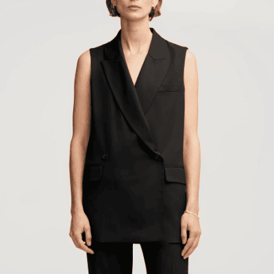 woman wears black double-breasted suiting vest