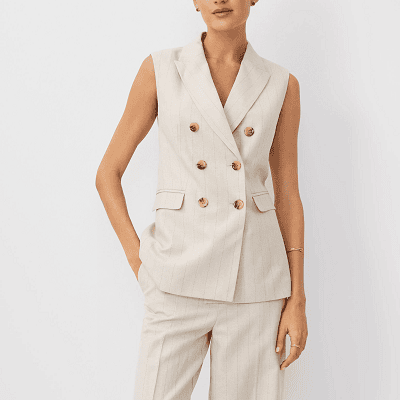 woman wears double-breasted sleeveless blazer from Ann Taylor