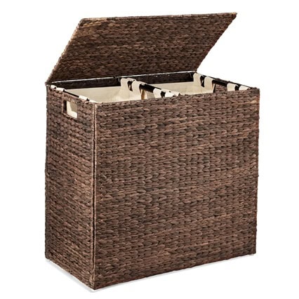 A brown woven hamper with a lid and two compartments