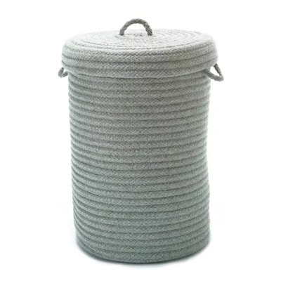 A light-green woven hamper with lid and top and side handles