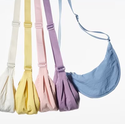 Five shoulder bags in white, yellow, pink, purple, and blue