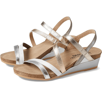 sandals with a cork base, silver wedge heel, and straps in shades of silver, rose gold, gold, and white