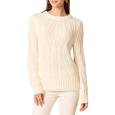 woman wears ivory cableknit sweater with white pants