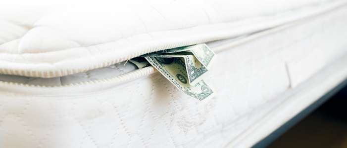 cash stuffed between mattress and box spring