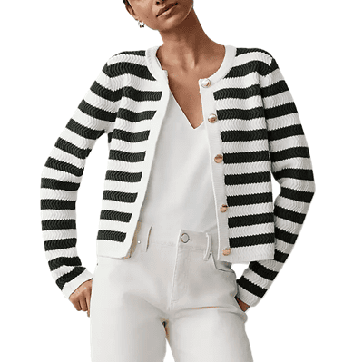 woman wears all white with black and white striped lady jacket