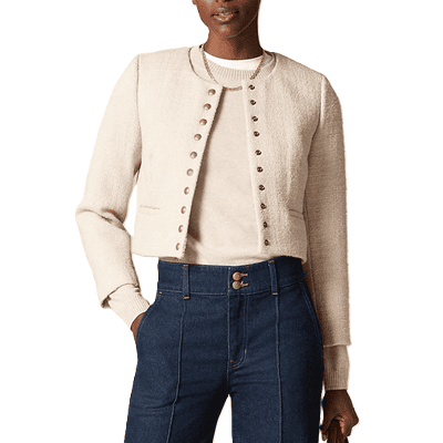 beige lady jacket layered with a sweater the same color