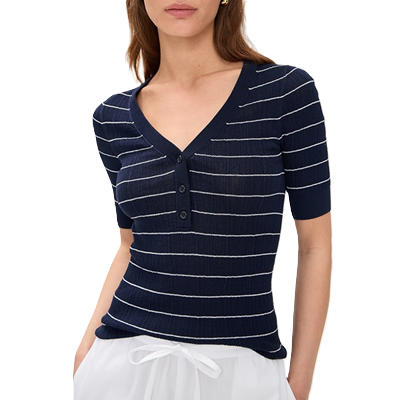 woman wears cute striped top for work, a navy and white short-sleeve Henley sweater