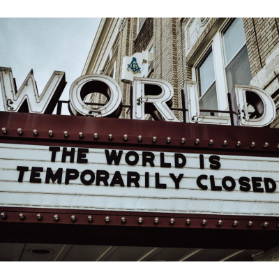 marquee at World theater reads, "The World is Temporarily Closed"