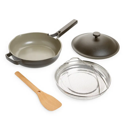 charcoal gray pan with top, steamer, and bamboo spatula