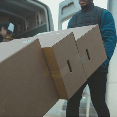 man moves large pile of boxes, the people moving may have found the right suburb for them