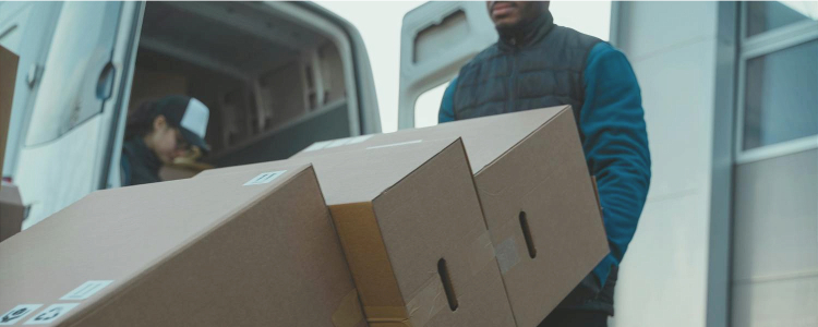 man moves large pile of boxes, the people moving may have found the right suburb for them