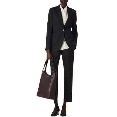 woman wears travel-friendly suit from Paul Smith