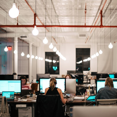 young professional women work in a business casual office after returning to the office