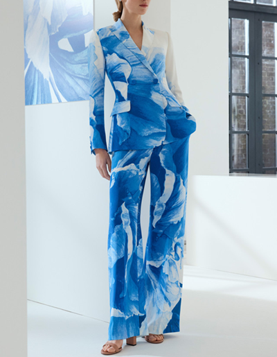 female executive wears blue and white suit with large peony pattern