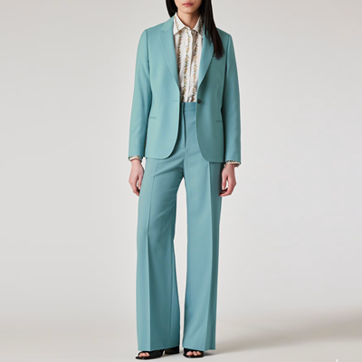 woman wears pale sea green suit
