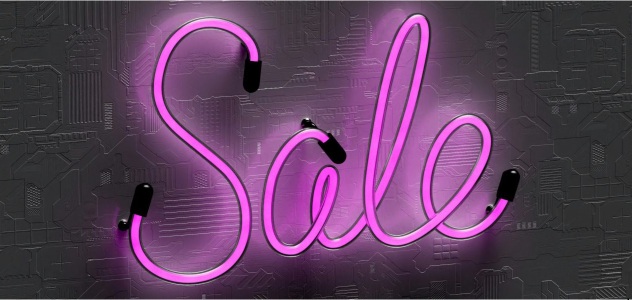 neon purple sign reads SALE in cursive