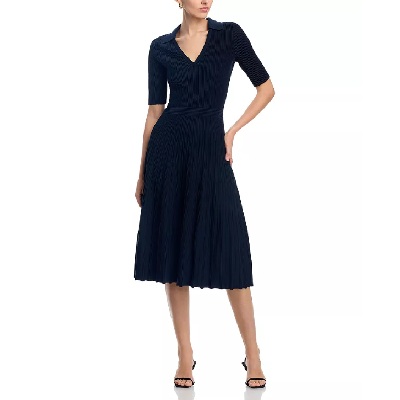 A woman wearing a dark navy blue collared dress with black sandals