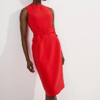A woman wearing a bright red sleeveless midi dress