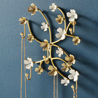 floral jewelry organizer that hangs on the wall