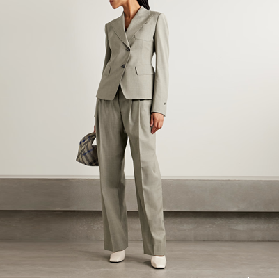 beigey gray suit with asymmetric button details on the blazer