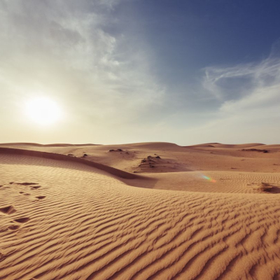 sun over a desert; it's what the office may feel like during a heat wave