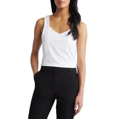 woman wears white tank with sweetheart neckline