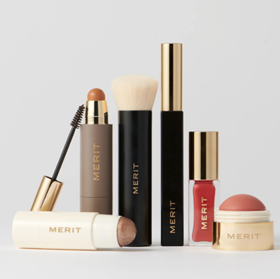 collection of Merit products for a "5 minute morning" including mascara, bronzer, illuminator, lip gloss, and blush