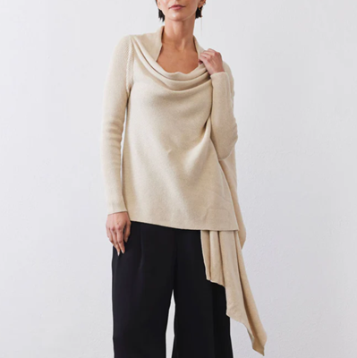 woman wears beige cardigan that has drapey details