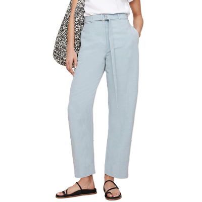 woman wears blue barrel pants with a work outfit