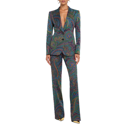 woman wears green paisley suit with purple accents