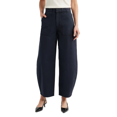 woman wears black barrel pants with work heels