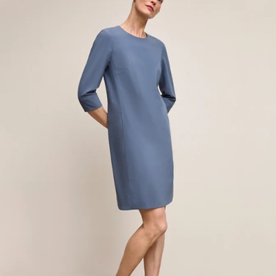 A woman wearing a powder blue dress